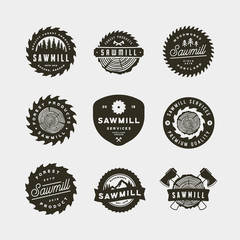 set of sawmill logos. retro styled woodwork emblems. vector illustration