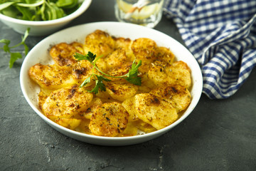 Homemade potato gratin with cheese and herbs