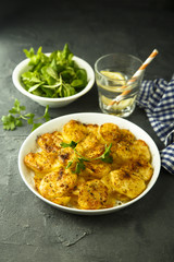 Homemade potato gratin with cheese and herbs