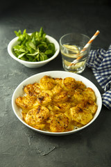 Homemade potato gratin with cheese and herbs