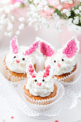 Bunny cupcakes with white cheese cream. Beautiful dessert for kids birthday