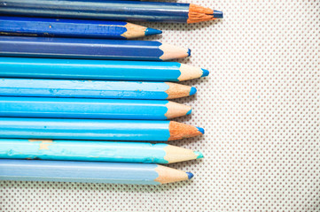 Fototapeta premium wooden colored pencils on white texture