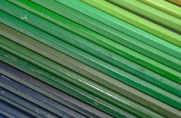 wooden colored pencils on white texture