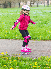 young girl with roller skates in the park