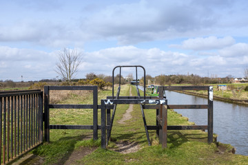 Fototapeta premium Barrier on towpath limiting vehicle and speed access in Cheshire UK