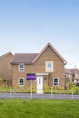 New house for sale with blank sign