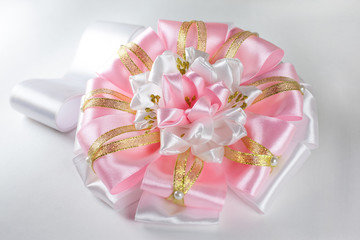 Pink bow isolated on white background