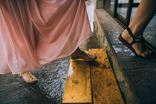 Young Woman Running In The Rain Without Umbrella