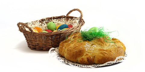 easter basket with easter eggs and yeast pastries bread plait