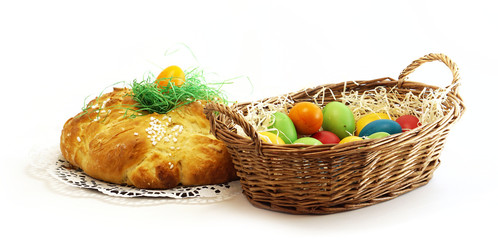 easter basket with easter eggs and yeast pastries bread plait