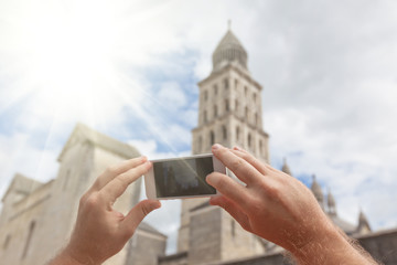 Tourist taking photo of Perigueux, France