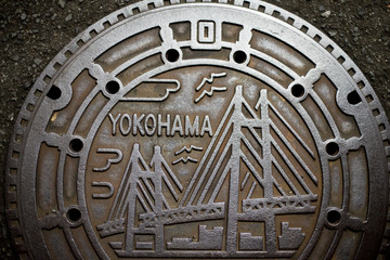 Manhole on the street of Yokohama, Japan. Yokohama is a port city located in a little south of Tokyo.