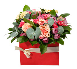 Bouquet of flowers in a red box with ribbon. Front view