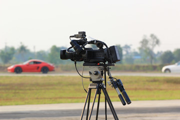 Video camera operator working at the race track