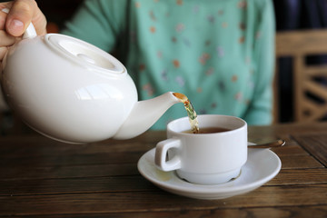 Woman pouring green tea
