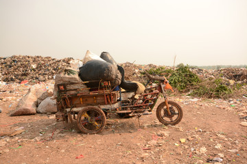 Workers separate waste for sale.Separate garbage collection. Recycling and storage of waste for further disposal.