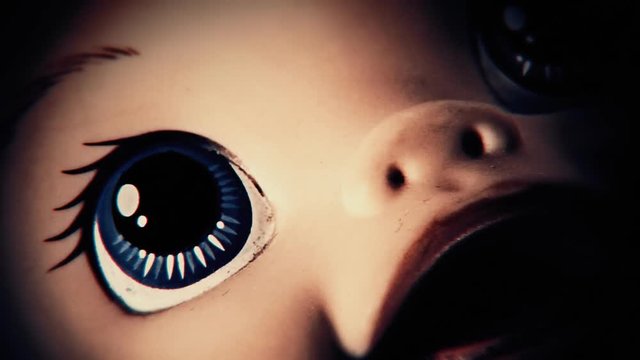 The disturbing face of a doll on a rotating surface.
