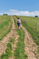 Woman hiking on summer hill near Liptovsky Trnovec, Slovakia.