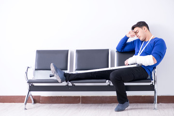 Desperate man waiting for his appointment in hospital with broke