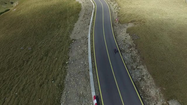 Aerial view of a man longboarding on Transalpina