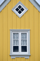 Windows of an old traditional wooden house.