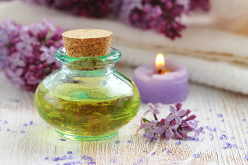 Fototapeta na wymiar SPA setting. Essential aroma oil with lilac