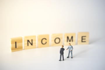 Businessmen talking about to hold on investing.