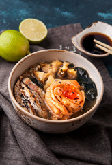 Japanese soup with salmon, eel, caviar with chopsticks and lime - 198852536