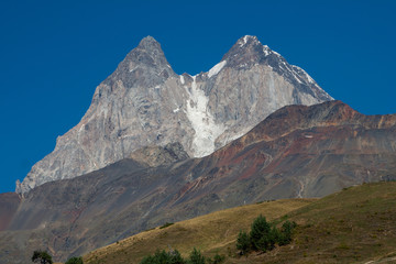 Fototapeta premium The Caucasus in Georgia. Beautiful mountain landscape. Svaneti. Nature and Mountain background. Mount Ushba