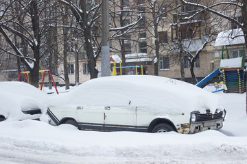 Parked car under snow