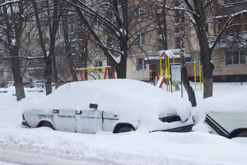 Parked car under snow