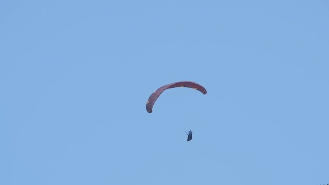 Paragliding on a clear sky 