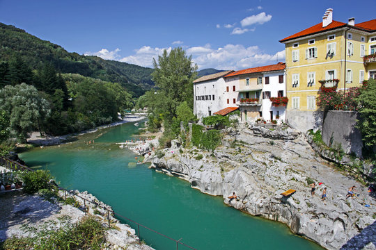 Beautiful rive Soca and ancient buildings in small  town Kanal, Slovenia