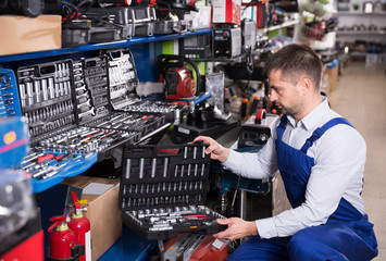 Man master is choosing adjustable wrench