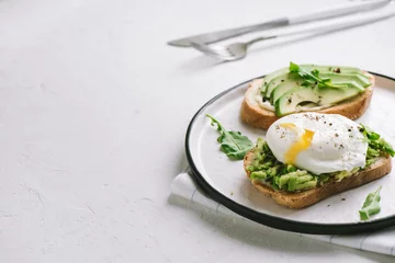 Foto op Canvas Avocado and Poached Egg Sandwiches © mizina