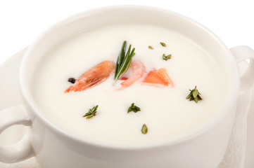 a plate of soup on a white background