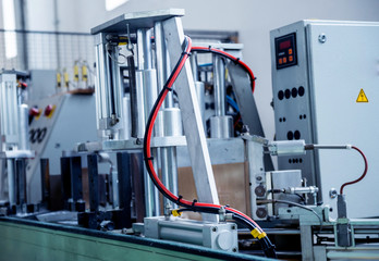 Factory for aluminum and PVC windows and doors production. Details industrial equipment.