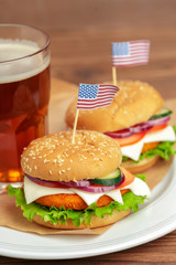 Fast food, homemade burger on a wooden background