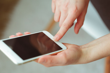 Woman typing write message on smart phone