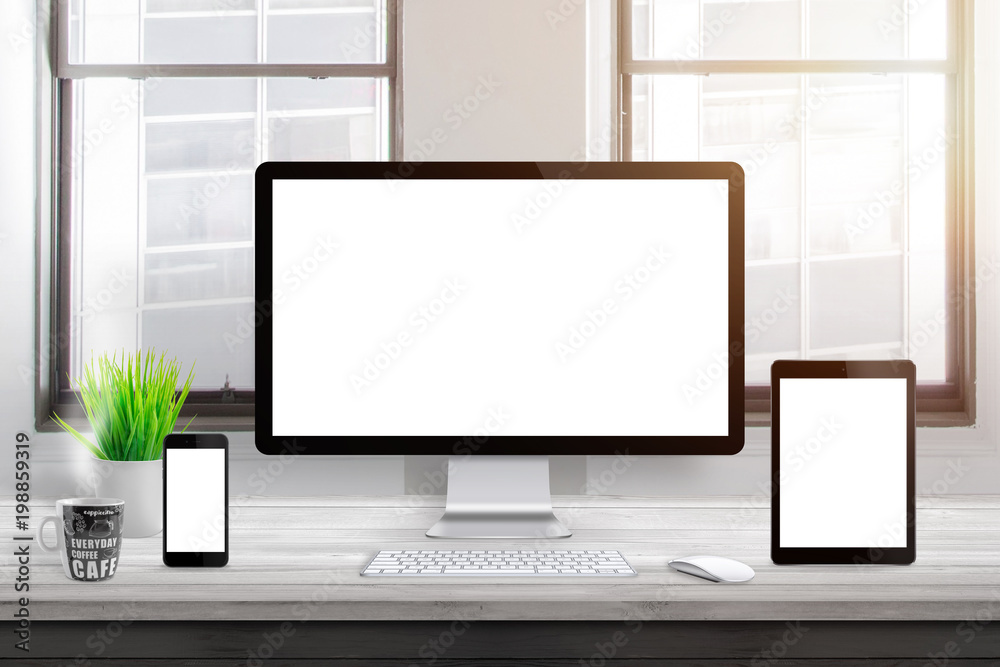 Poster responsive devices mockup on office desk. isolated, blank computer display, tablet and mobile phone.