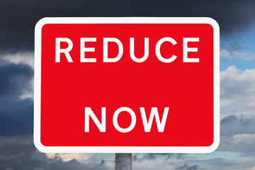 Traffic sign REDUCE NOW copy space
