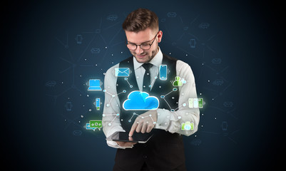 Chalk drawn cloud technology symbols on a tabled handled by businessman
