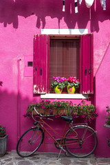 Fototapeta na wymiar The colourful houses on the street of Burano island