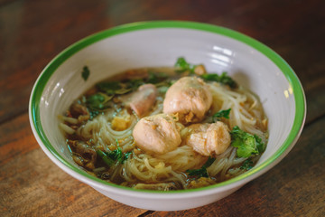 Noodle and soup in bowl put on the table