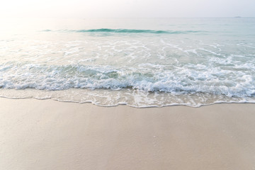 Smooth wave and sand on the beach
