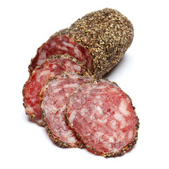 Dried organic salami sausage covered with pepper on white background