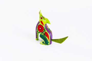 Mexican green and red alebrije from oaxaca isolated on white background. From above
