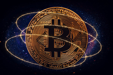 Golden Bitcoin over dark background. Business and virtual cryptocurrency concept.