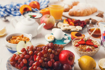 Fototapeta na wymiar Fresh healthy breakfast with fruits closeup