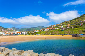 Famous beach of Machico in summer holiday, with sunshine and blue water of the sea in Madeira - Portugal © cristianbalate